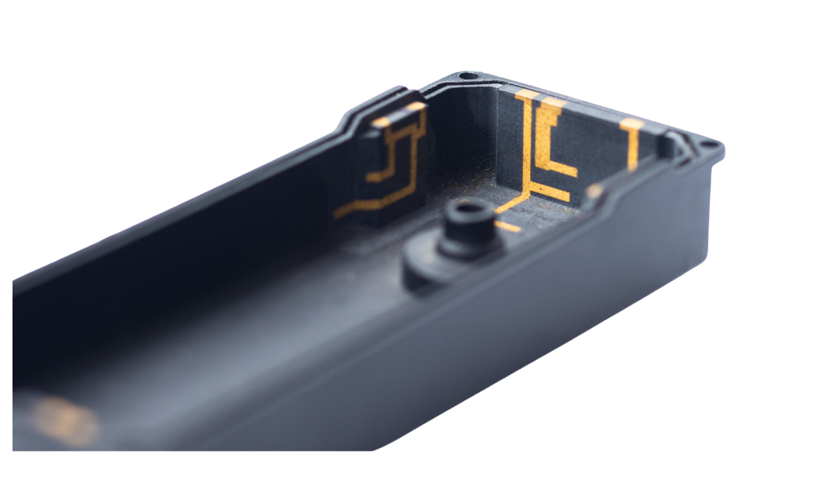 Antenna traces integrated onto a three-dimensional plastic housing